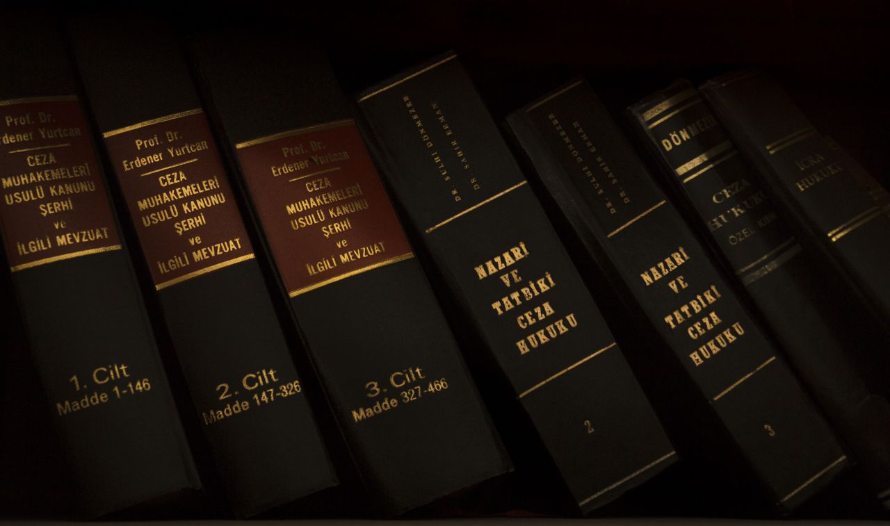 Mastering the First Impression: Your intriguing post title goes here Stack of legal and literature books in a library showcasing various volumes.
