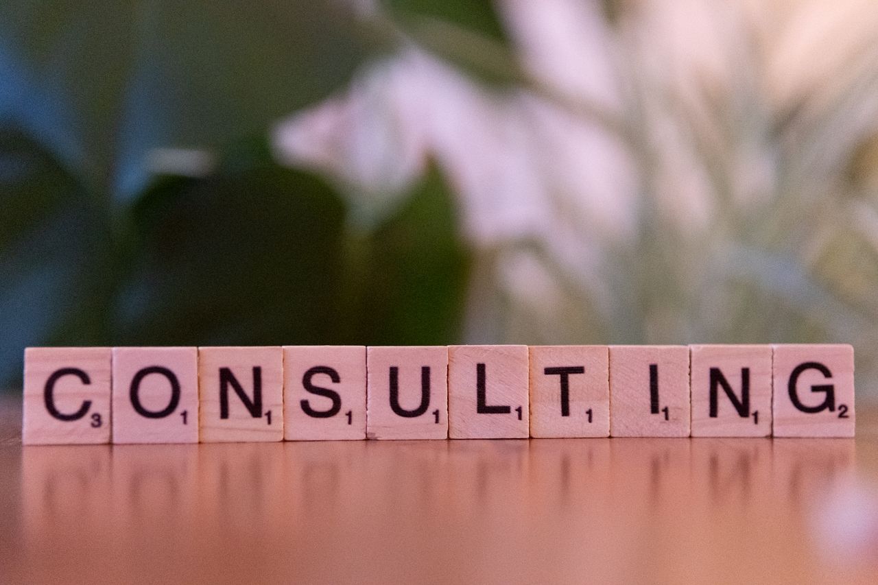 The Art of Drawing Readers In: Your attractive post title goes here Wooden letter tiles spelling 'Consulting' with a blurred background. Ideal for business concepts.